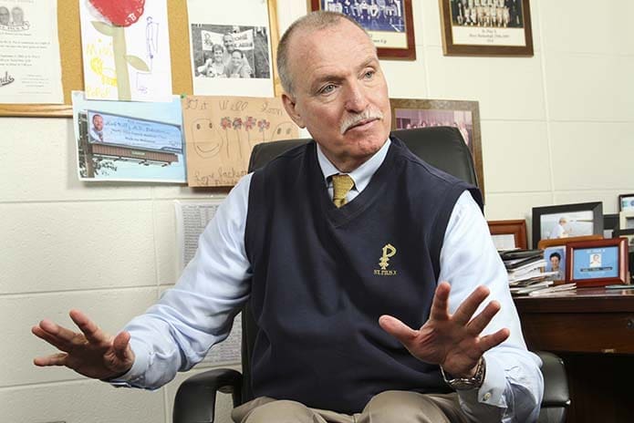 Former St. Pius X religion teacher Msgr. Richard Lopez said if you have any doubt how smart Mark is, look no further than Linda, his wife. Kelly concurs, hands down, the best decision he ever made was marrying Linda. They will celebrate their 40th wedding anniversary this June. They have four children and nine grandchildren. Photo By Michael Alexander