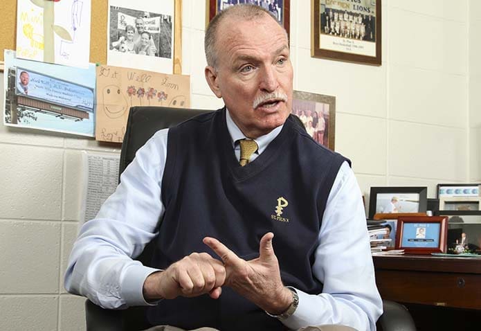 Mark Kelly worked at St. Pius X High School, Atlanta, for 42 years, 31 of those years as the athletic director. He attributes the school’s spiritual focus to its three original pillars. They include founding principal Father James Harrison, the late Coach George Maloof and the late Grey Nuns of the Sacred Heart Sister Rita Marie Raffaele, who was an assistant principal and educator. Photo By Michael Alexander