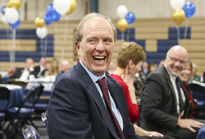 Chuck Byrd laughs during the retirement luncheon as Mark Kelly shares his top five funniest moments while working at St. Pius. Kelly and Byrd, a former counselor, admissions director and tennis coach at St. Pius, have been friends for 42 years. The two buddies, who like to fish together, also coached basketball alongside each other for nearly 20 years. Byrd retired in 2017 too. Photo By Michael Alexander