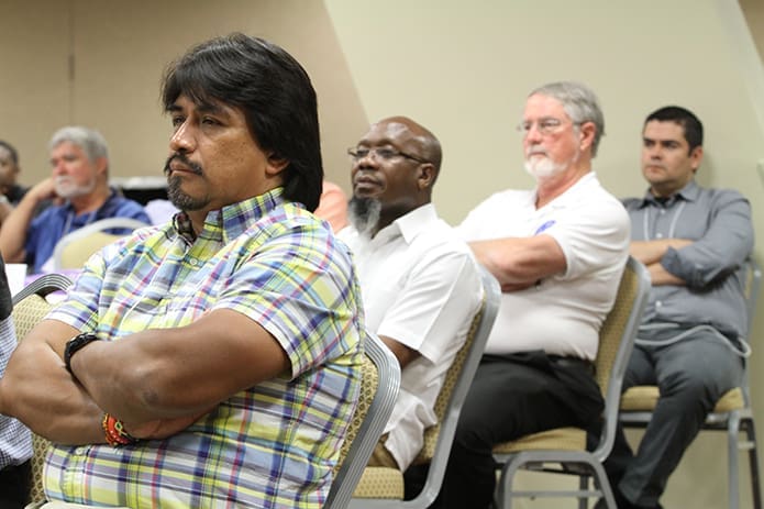 (Front to back) Father Jose Enrique Gonzalez, pastor of Divine Redeemer Church, Boonville, N.C., Father Pius Wekesa, pastor of St. John the Baptist Church, Roanoke Rapids, N.C., Redemptorists Father Mark Wise, parochial vicar at Our Lady of Guadalupe Church, Newton Grove, N.C., and the Archdiocese of Atlanta's Father Roberto Herrera, pastor of Christ Our King and Savior, Greensboro, listen to the afternoon speaker Basilian Father Thomas Rosica. Photo By Michael Alexander