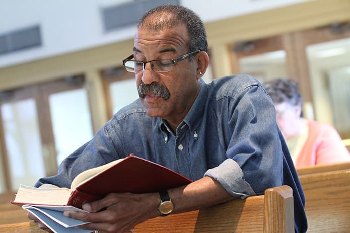 Russell Lewis of Corpus Christi Church, Stone Mountain, joins others in praying Psalm 51 (Prayer of Repentance). While some of the five-hour prayer service included prepared readings and a talk by the pastor, Claretian Father John Molyneux, there was also heartfelt, extemporaneous prayer. Corpus Christi served as a host site on May 5 when the theme was Holiness and Purpose. Photo By Michael Alexander