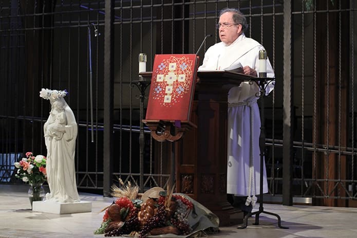 Deacon Ed Patterson of Our Lady of the Assumption Church, Atlanta, leads the fourâhour, afternoon period of exposition of the Eucharist, silent meditation and prayerful reflection during Atlanta Prays. On May 8 Our Lady of the Assumption served as an inside the perimeter host site for the north side of the city when the theme was Love. Photo By Michael Alexander