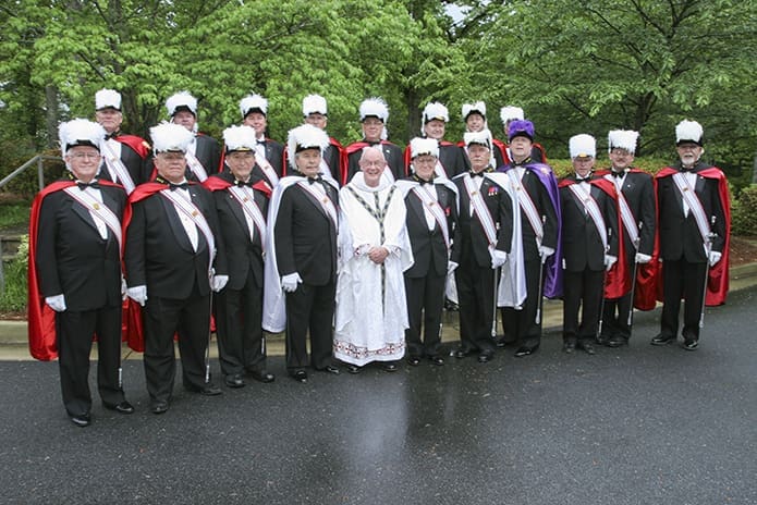 Msgr. R. Donald Kiernan poses for a photo with the Knights of Columbus from All Saints Church, Dunwoody, following the May 2, 2009 Mass marking his 60th anniversary as a priest. Photo By Michael Alexander