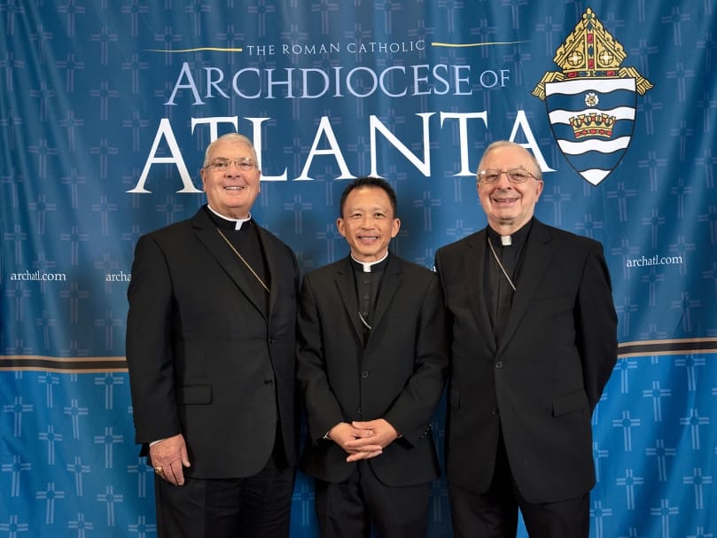 Bishop-designate John Nhan Tran, center,  is welcomed by Archbishop Gregory J. Hartmayer, OFM Conv., left, and Bishop Joel M. Konzen, SM, right, during a press conference held at the Chancery of the Archdiocese of Atlanta on Oct. 25. Photo by Johnathon Kelso