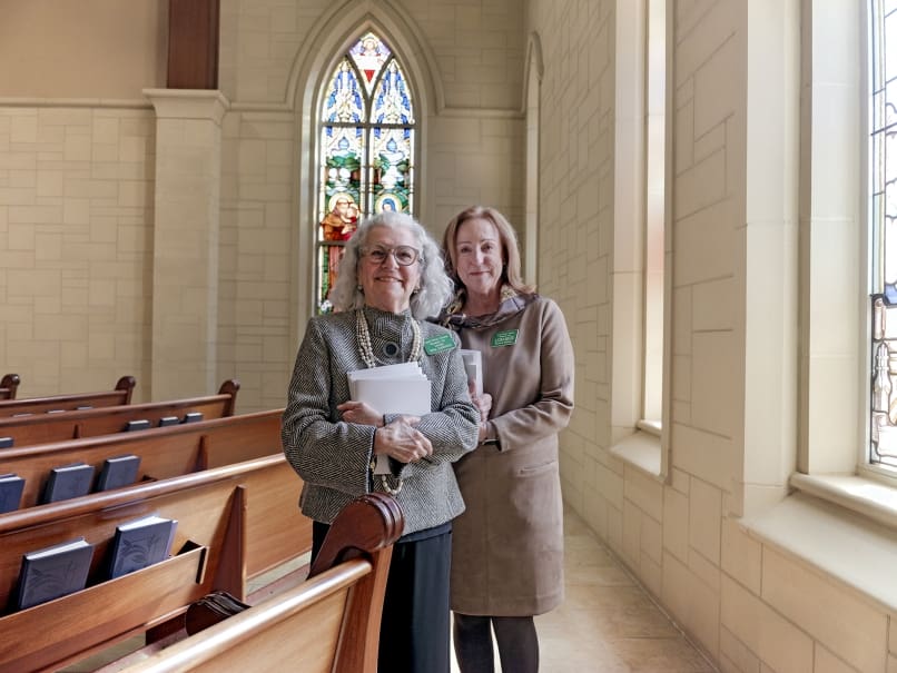 Ushers Vera Sorensen, left, and Elizabeth Bachman, right, prepare to help guests at St. Peter Chanel Church in Roswell during the ordination of Bishop John Nhan Tran held on Jan. 23. Photo by Johnathon Kelso