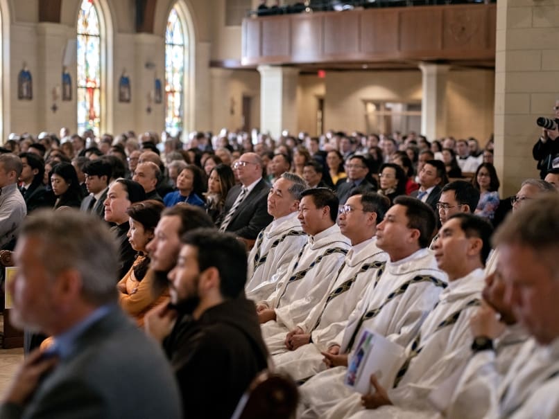 Clergy and the faithful listen as Archbishop Gregory J. Hartmayer, OFM Conv., delivers the homily during the ordination of Bishop John Nhan Tran at St. Peter Chanel Church. Photo by Johnathon Kelso