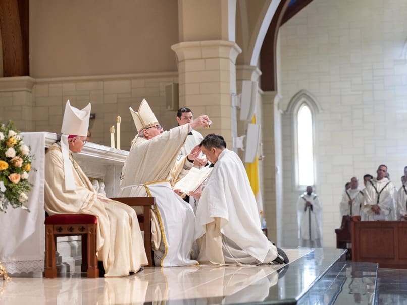 Archbishop Gregory J. Hartmayer, OFM Conv., anoints Bishop Tran's head with sacred chrism as a sign of his share in Christ's high priesthood and spiritual anointing. Bishop Tran was ordained Atlanta's newest auxiliary bishop on Jan. 23. Photo by Johnathon Kelso