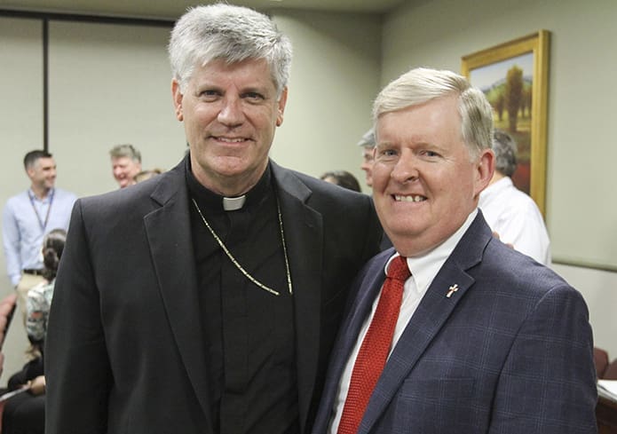 Bishop Bernard E. (Ned) Shlesinger III, left, a priest of the Diocese of Raleigh, stands with his friend, Deacon William O'Donoghue, of Our Lady of the Assumption Church, Atlanta, prior to a May 15 press conference, where Archbishop Wilton D. Gregory introduced him as the Archdiocese of Atlanta’s new auxiliary bishop. Bishop Shlesinger and Deacon O'Donoghue, who was ordained in 2011, served in the U.S. Air Force together as pilots. Photo By Michael Alexander