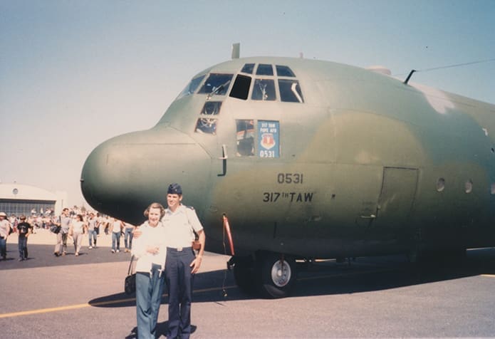 Bishop Bernard E. (Ned) Shlesinger III is pictured in 1985 with his mother, the late Rita Belmont Shlesinger, as they stand in front of a Lockheed C-130 Hercules turboprop military transport aircraft at Pope Field, Fayetteville, N.C. Photo Courtesy of Shlesinger Family