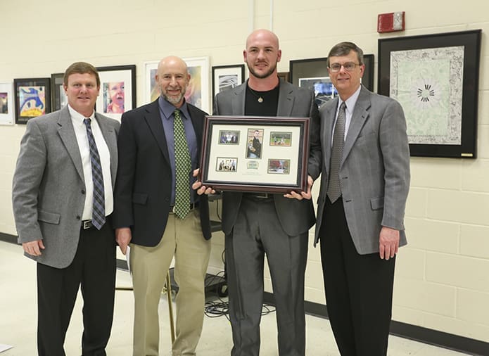 After his official induction into the Blessed Trinity High School Athletic Hall of Fame, Tyler Flowers, second from right, is joined in a photo by (l-r) athletic director Ricky Turner, his former baseball coach Andy Harlin and principal Frank Moore. Photo By Michael Alexander