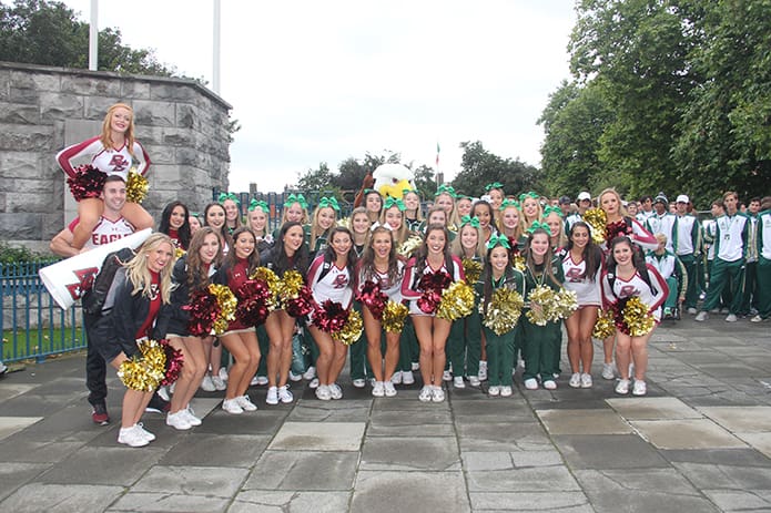 Blessed Trinity High School cheerleaders pose for photograph with the Boston College cheerleaders as they gather for the Sept. 1 parade through downtown Dublin, Ireland. Photo By Patrick Dever