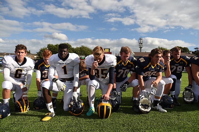 Players from Miami’s Belen Jesuit Preparatory School and Atlanta’s Marist School come together in a circle for a pregame prayer led by Belen Jesuit school president, Father Guillermo M. García-Tuñón, and Marist principal Father Joel Konzen. Cody Glenn / SPORTSFILE
