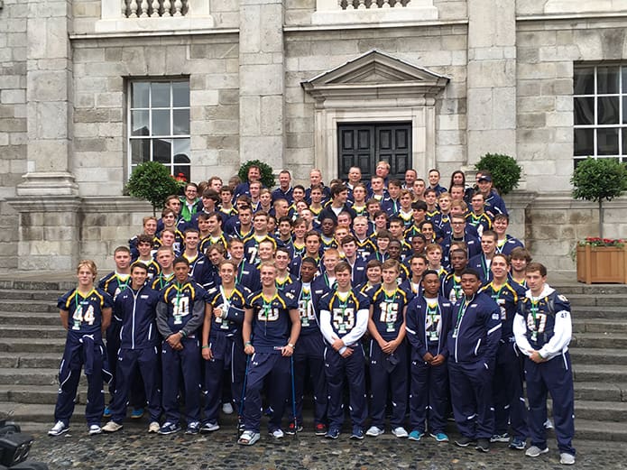 Marist School football players and coaches gather on the steps of a building on the Trinity College campus in Dublin during the Sept. 1 pep rally. Photo Courtesy of Marist School