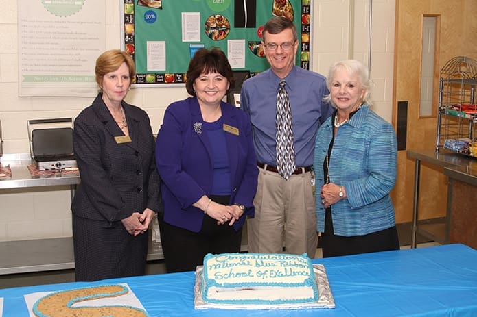 (L-r) Connie Urbanski, Ed.D., assistant superintendent of schools, and Diane Starkovich, Ph.D., superintendent of schools, join Frank Moore, Blessed Trinity High School principal and Susan Dorner, assistant principal, for a celebratory photo on Sept. 30, the day the school was named a National Blue Ribbon School of Excellence. Photo By Michael Alexander