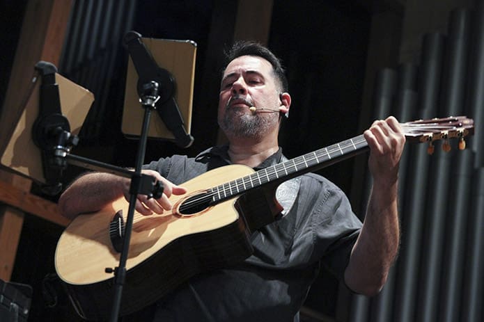 Jose Fernandes plays guitar in the choir during the Sept. 26 evening Portuguese Mass at Holy Family Church, Marietta. Fernandes and his family relocated from Rio de Janeiro to Atlanta in June of 2016 for a job transfer with his company. Photo By Michael Alexander