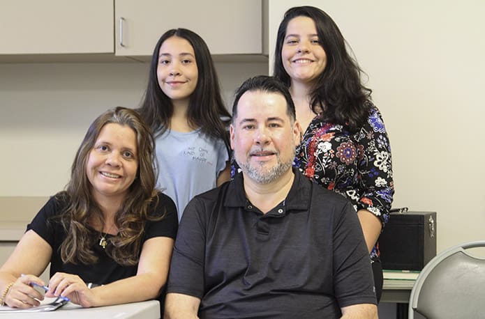 (Clockwise, from bottom right). Jose Fernandes, his wife, Sandra, his 13-year-old daughter, Anna Julia and his 20-year-old daughter, Nathalia, have only been in the Atlanta area for just over a year, but they are actively involved with the Brazilian Catholic community. Photo By Michael Alexander