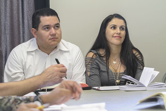 Galdino and Karla Guimaraes join some 23 other participants during the adult Bible study at St. Jude the Apostle Church in Sandy Springs Oct. 1. Photo By Michael Alexander