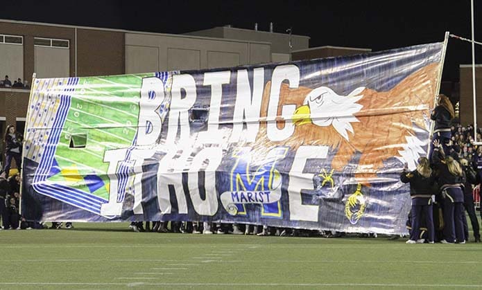 Bring It Home, as in bring home the championship trophy, says the Marist banner raised on the field just before the start of the game. Photo By Michael Alexander