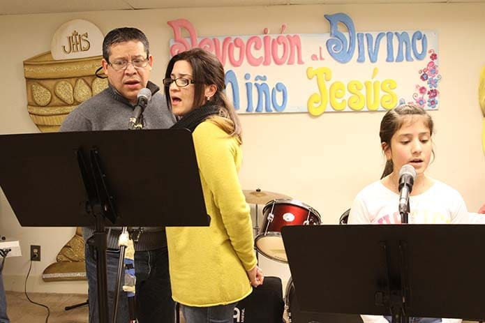 (L-r) Edward and Linda Cervantes and 10-year-old Maria Medina were some of the choir members who provided vocals during the Dec. 12 Our Lady of Guadalupe feast day liturgy at Divino Niño Jesús Mission in Duluth. Photo By Michael Alexander
