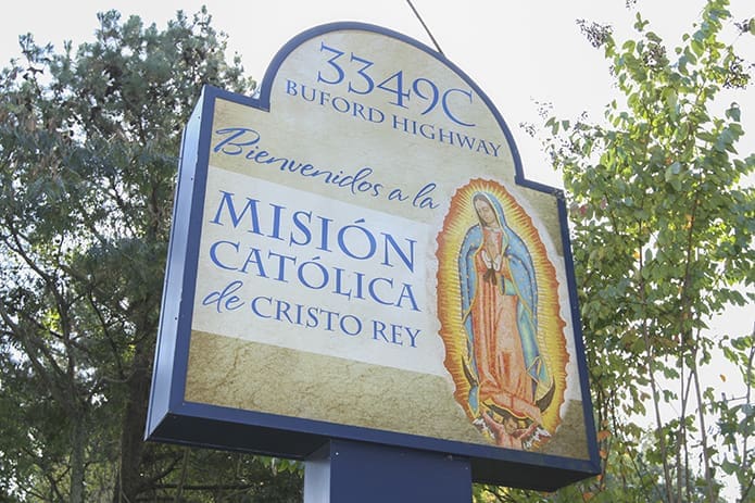 A sign looms over the entrance to the Cathedral of Christ the King Hispanic Mission, Atlanta. Photo By Michael Alexander