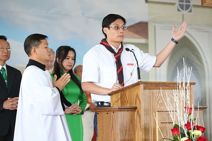 Christopher Nguyen, 19, was one of the parish representatives who led the general intercessory prayers during the Aug. 27 Mass. Photo By Michael Alexander