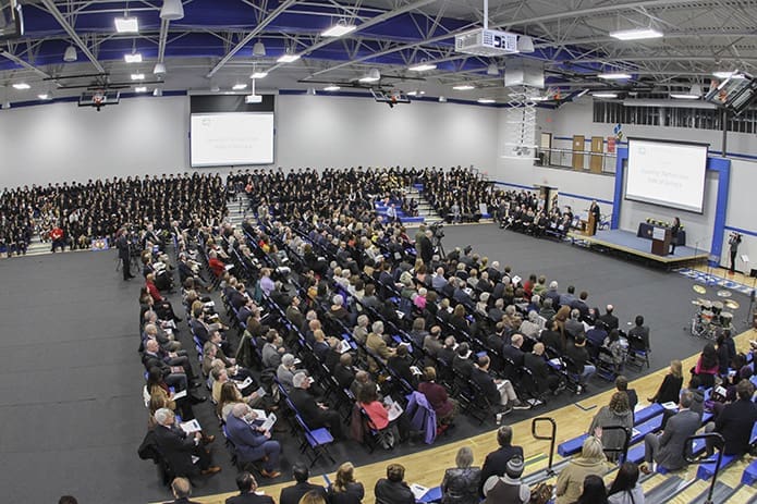 Hundreds of people fill the Robert M. Fink Family Gymnasium at Cristo Rey Atlanta Jesuit High School for the Jan. 30 school building dedication. They heard various civic, political and religious heads speak leading up to the ribbon cutting ceremony. Photo By Michael Alexander