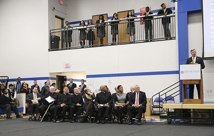 Bill Garrett, president of Cristo Rey Atlanta Jesuit High School, provides some closing remarks to conclude the speaking portion of the ribbon cutting ceremony. Photo By Michael Alexander