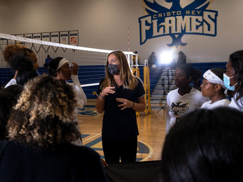 Cristo Rey's Assistant Varsity Coach Colleen Hunsberger coaches the players before the match against Notre Dame Academy. Photo by Johnathon Kelso
