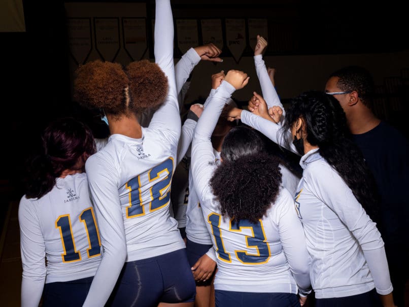 The Cristo Rey Flames celebrate a home game victory over Notre Dame Academy. Photo by Johnathon Kelso