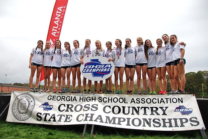The Marist School girls cross-country team captured the Class AAAA state championship once again Nov. 7. They have made a habit of holding the championship trophy on the podium every year since 2008.