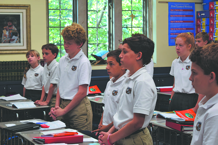 Sixth-grade students participate in a prayer service for peace at Christ the King School, Atlanta. Photo By Lori Lummus