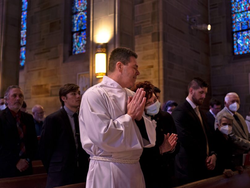 Deacon Rodney Arion and his wife,Jamie, pray together during the Mass of Permanent Diaconate at the Cathedral of Christ the King. Photographer, Johnathon Kelso