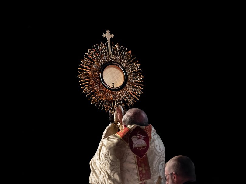 Bishop Joel M. Konzen, SM, elevates the monstrance during the Benediction of the Blessed Sacrament before the crowd at the 25th Eucharistic Congress of the Archdiocese of Atlanta. Photo by Johnathon Kelso