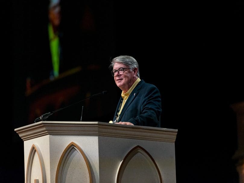 Deacon Dennis Dorner welcomes attendees to the 25th Eucharistic Congress at the Georgia International Convention Center in College Park  on June 18. Photo by Johnathon Kelso