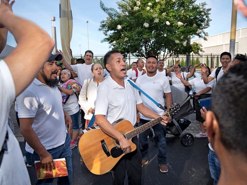 Members of San Felipe De Jesús Church of Forest Park worship during the morning procession Saturday at the 25th Eucharistic Congress. Photo by Johnathon Kelso
