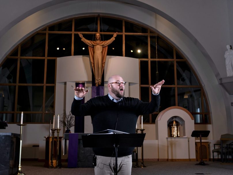 Dónal P. Noonan, director of music at the Shrine of the Immaculate Conception, will lead the Eucharistic Congress Choir at the event in June with songs celebrating the Eucharist. He conducted the most recent rehearsal March 27 at St. Andrew Church, Roswell. Photo by Johnathon Kelso