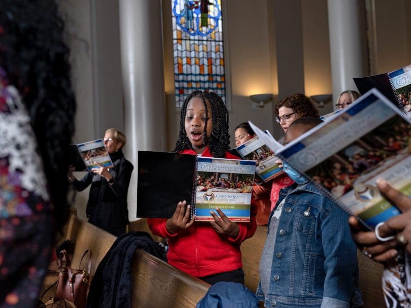 The Congress Choir rehearses at St. Andrew Church. The song selections reflect the theme of the 25th Eucharistic Congress, "Come to Me."  Photo by Johnathon Kelso