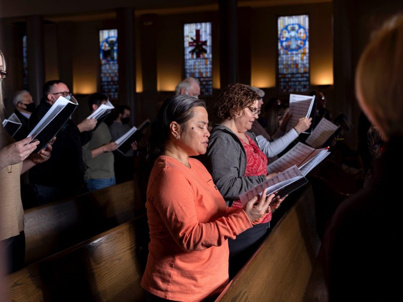 Choir members rehearse for the 25th Eucharistic Congress under the direction of Dónal P. Noonan at St. Andrew Church, Roswell, March 27. The rehearsals for the 107-member choir are being held at different parishes each month to accommodate members’ schedules. Photo by Johnathon Kelso