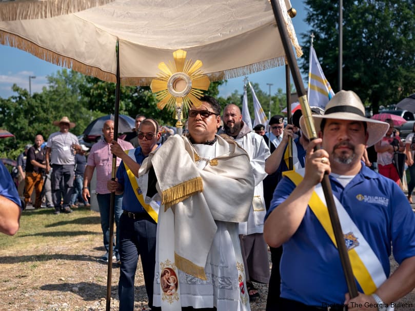 Father Refugio Oñate Melendez processes with the Blessed Sacrament at St. Joseph Church in Dalton during a stop of the Eucharistic Pilgrimage. Photo by Johnathon Kelso
