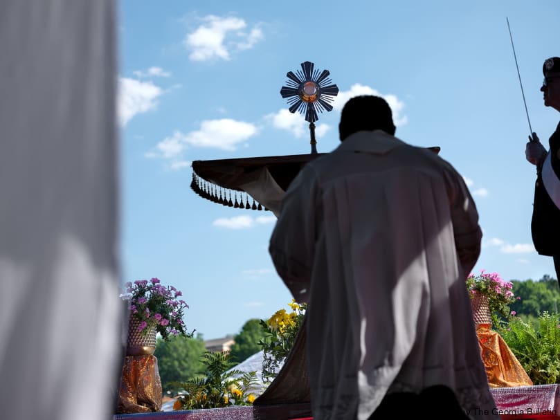 Father Refugio Oñate Melendez adores the Blessed Sacrament at St. Joseph Church in Dalton. Photo by Johnathon Kelso