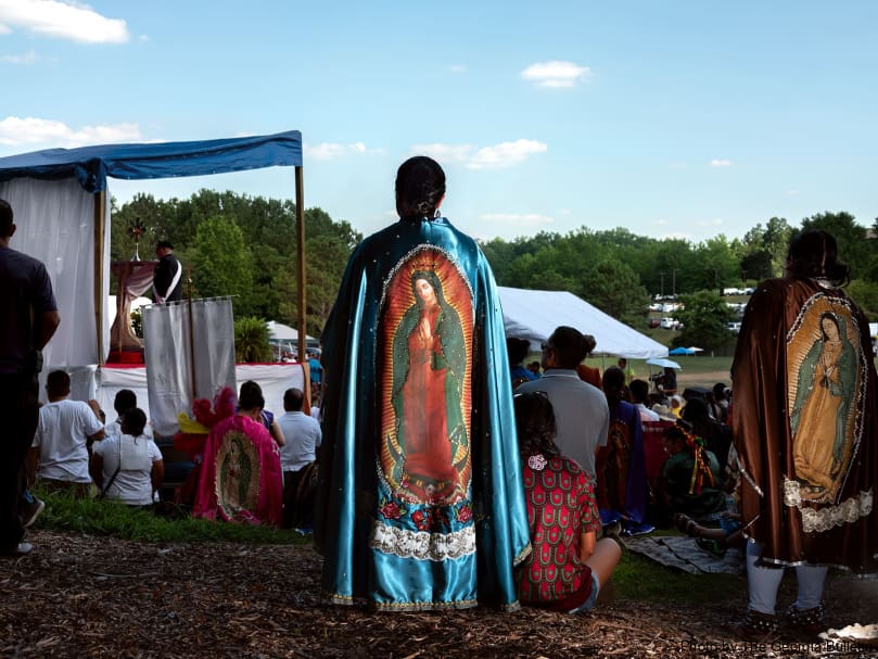 A young woman adores the Blessed Sacrament as the National Eucharistic Pilgrimage visted St. Joseph Church in Dalton. Photo by Johnathon Kelso