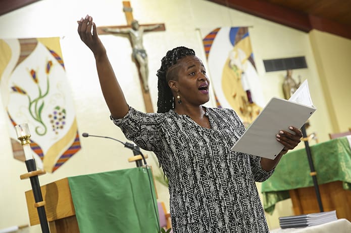 Shana-Gay Jones, a member of Atlanta’s Our Lady of Lourdes Church choir, served as one of two cantors during the evening prayer service for St. Dominic. The service was part of the celebration marking the 800th jubilee of the Dominican order this year. Photo By Michael Alexander