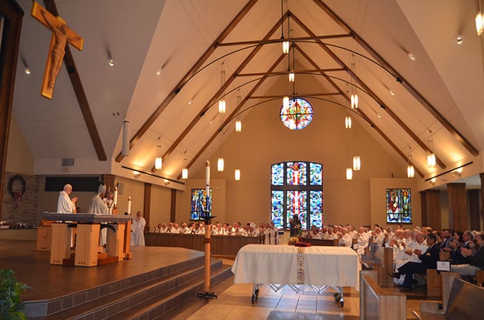At the funeral Mass for Father Richard A. Kieran at Immaculate Heart of Mary Church, Atlanta, on Nov. 28, Archbishop Wilton D. Gregory thanks Father John Kieran for his devoted care of his brother. PHOTO BY CINDY CONNELL PALMER