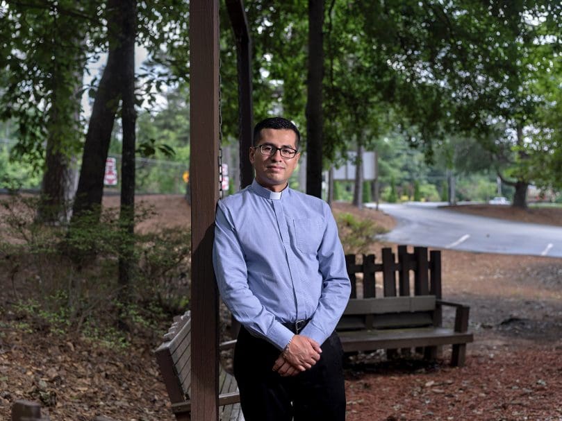 Father Rodrigo Padrón-Pérez, MNM, is photographed in the memorial garden at St. Thomas the Apostle Church, Smyrna, where he would pray and discern the priesthood as a teenager. His ordination to the priesthood was on Pentecost, June 5. Photo by Johnathon Kelso
