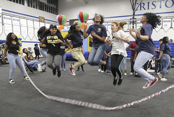 During the senior picnic, India Haney twirls the rope as (l-r) Amaya Carthan, Nina Dunwoody, Gabrielle Wilson, Jada Milligan, Veronica Soto-Vergara, and Diamond Dale take their turn at jumping. All seven of the students will be attending a college or university after graduation. Two will be going out-of-state and the other five will be going in-state. Photo By Michael Alexander