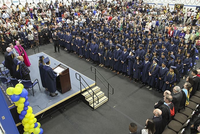 Cristo Rey Atlanta Jesuit High School’s senior class of 2018, the school’s inaugural graduating class of 125 students, is all accounted for after processing into the Robert M. Fink Family Gymnasium for the May 19 commencement exercises. Photo By Michael Alexander