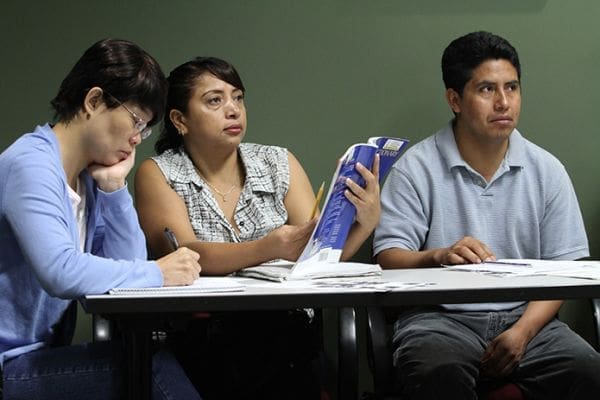 (L-r) Ming Ming of China, Blanca Gonzalez of Honduras and Jacinto DeLeon of Guatemala attend the August 13 English Literacy class at the Senior Connections Building in Chamblee. Photo By Michael Alexander