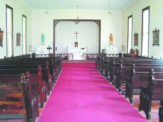 The inside of Purification Church includes the simple benches, statues and art of a country parish. Parishioners at nearby St. Joseph’s in Washington are seeking to have the Georgia Trust place Purification on their Places in Peril list for 2014. Photo by Amber Smith