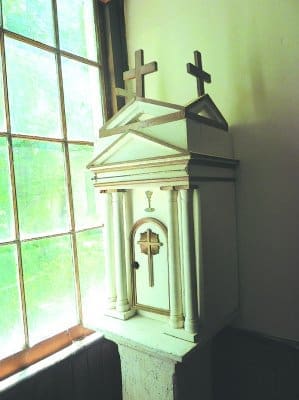 The church’s original tabernacle is located behind the altar at Purification Church. Photo by Angelique Richardson