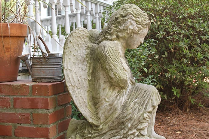 Like guardians of the women in recovery, angels rest at the base of the homeâs exterior steps on both sides. Photo By Michael Alexander